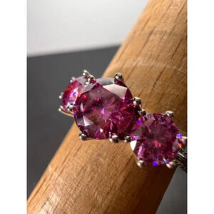 Pink moissanite trilogy ring in platinum over sterling silver size 7